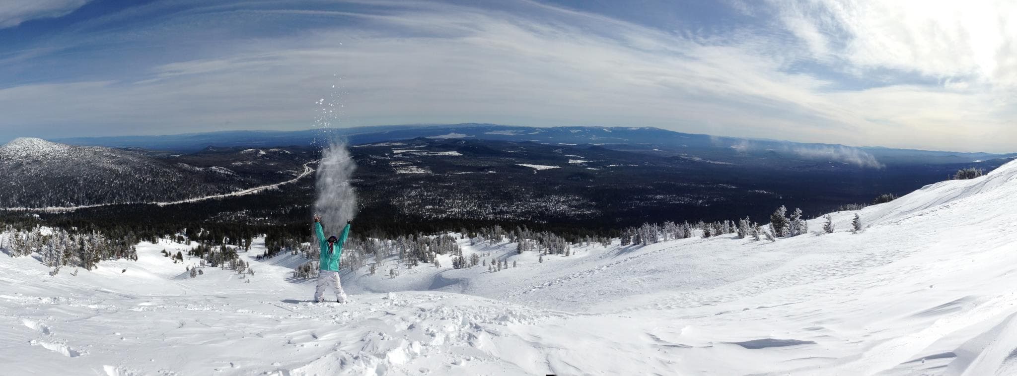 Snowy mountain panorama — Jack tossing snow into the sky